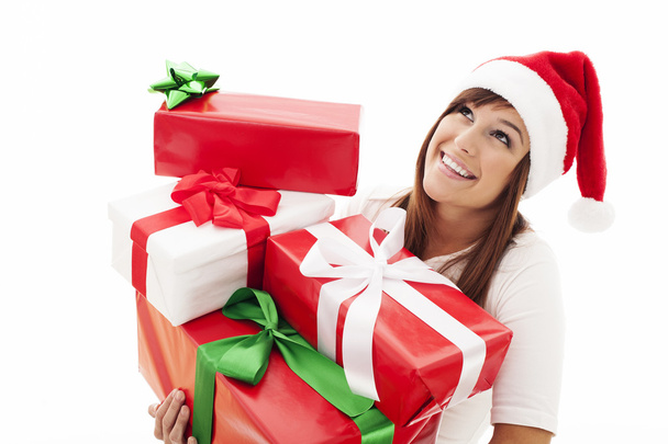 Woman with stack christmas gifts - Фото, изображение