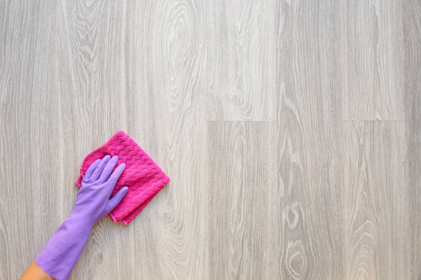 Woman cleaning wooden floor, top view - Фото, изображение