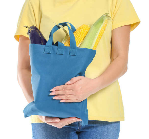 Woman with fresh vegetables in eco bag on white background, closeup - Φωτογραφία, εικόνα