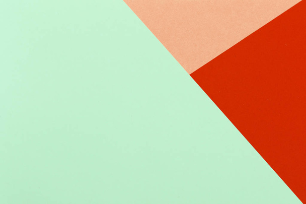 Paper red, orange, green, pastel empty background, geometrically located. Color blank for presentations, copy space. - Foto, imagen