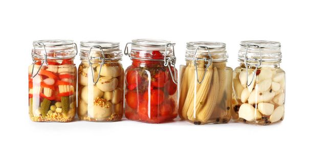 Jars with canned vegetables on white background - Photo, Image