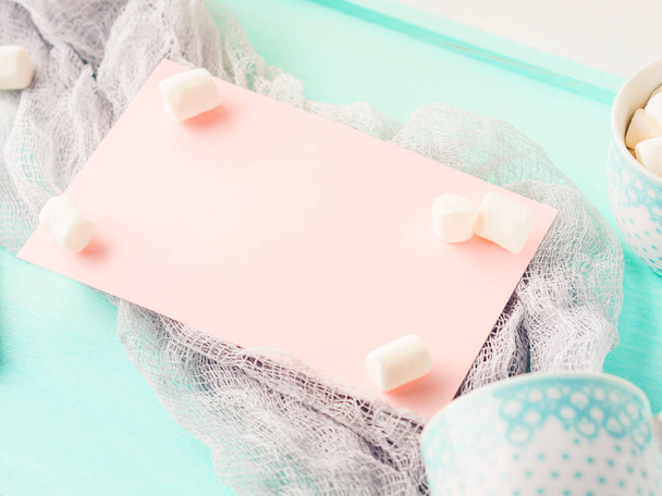 Pink card and marshmallows on turquoise - Photo, Image