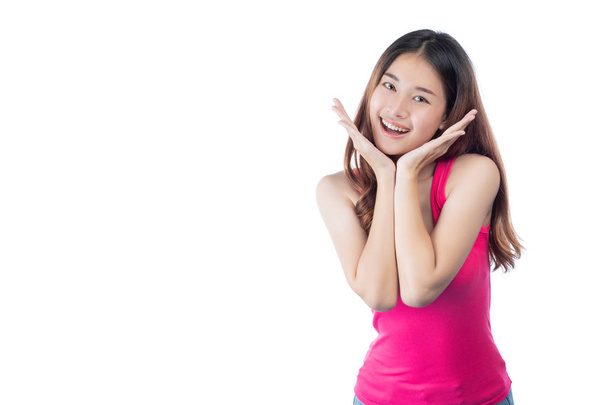 Beautiful woman wears a pink shirt with a smile showing her hand, isolated on white background. - Φωτογραφία, εικόνα