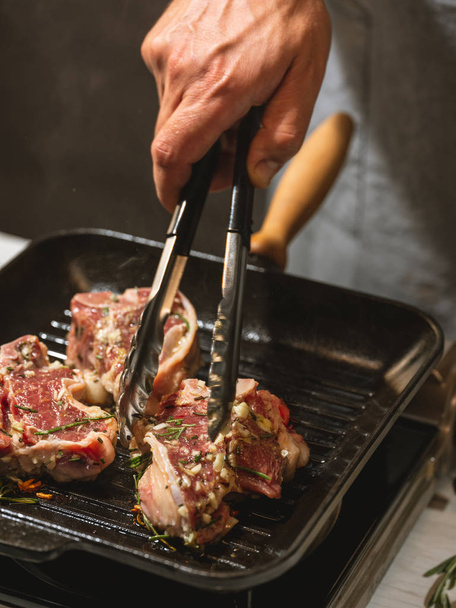 Chef preparing meat on grill - Фото, зображення