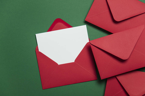 Blank white card with red paper envelope Christmas card template - 写真・画像