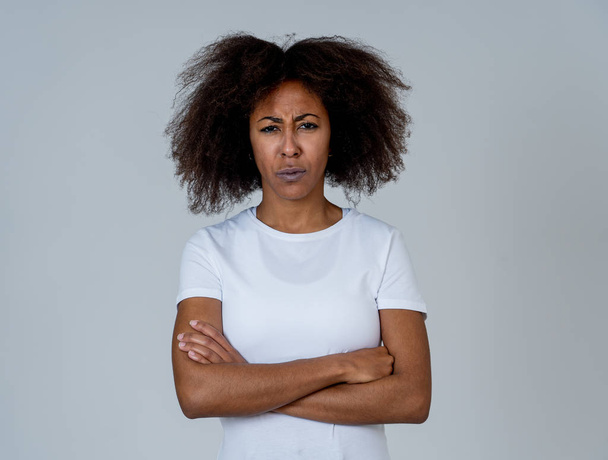 Portrait of attractive frustrated african american woman with angry and stressed face. Looking mad and crazy shouting and making furious gestures. Facial expressions and emotions and mental health. - Photo, image