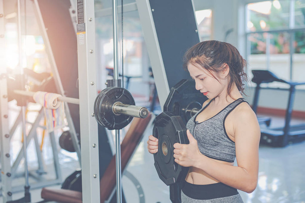 Girl playing fitness in the gym. - 写真・画像