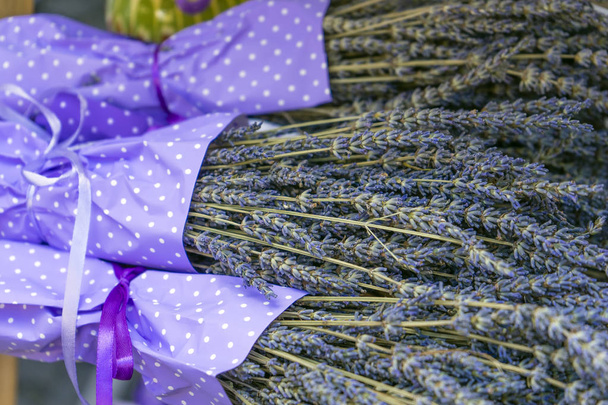 beautiful lavender flowers in festive packaging close-up - Фото, изображение
