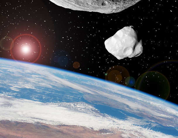 Des astéroïdes au-dessus de la terre. Les éléments de cette image meublés
  - Photo, image