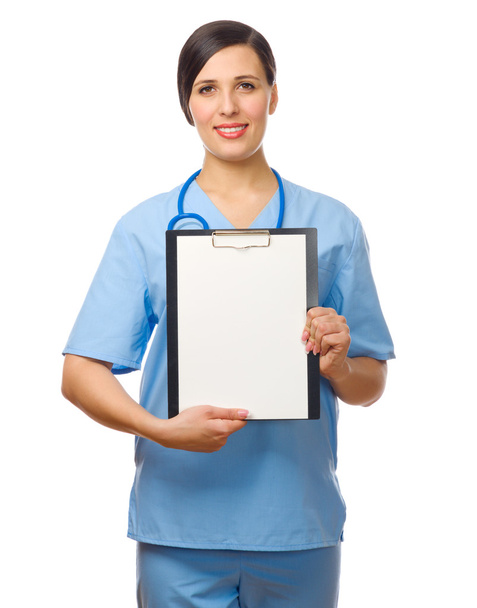Young doctor with clipboard - Foto, afbeelding