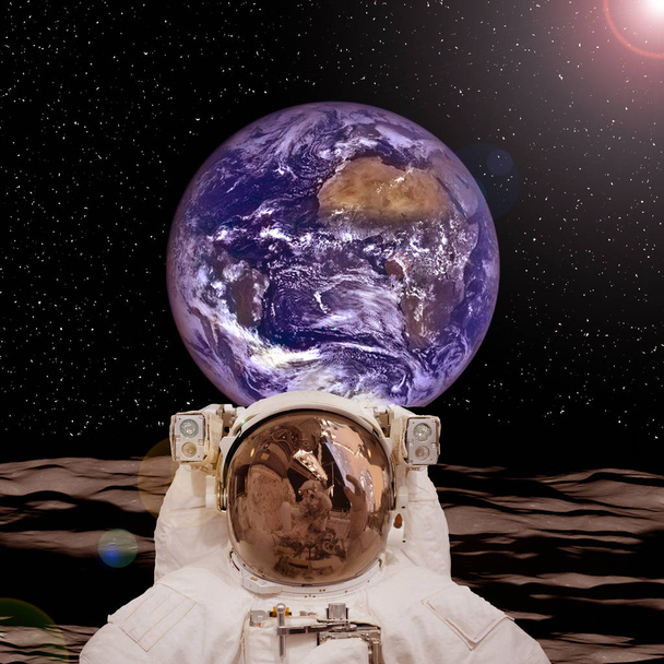 Astronaut posing on the moon. The elements of this image furnish - Photo, Image
