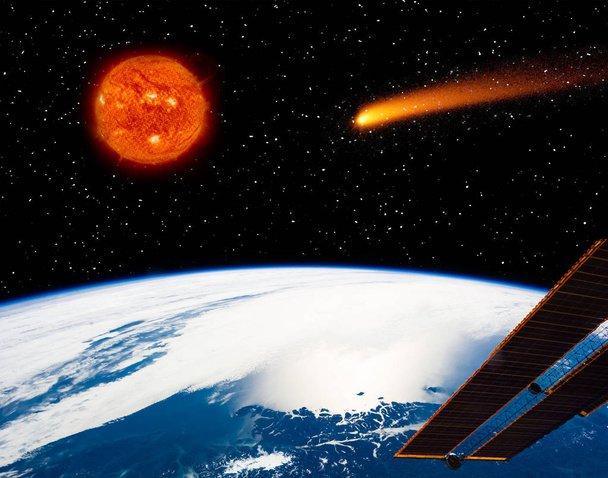地球、燃える太陽と飛ぶ彗星。このイメージの要素  - 写真・画像