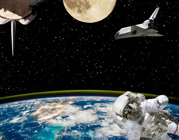 Astronaut, spaceships and moon. Earth on the backdrop. The eleme - Photo, Image