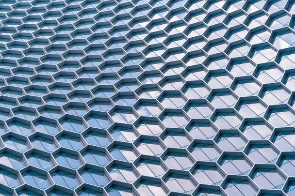 Office buildings. Structure of hexagon windows in futuristic tec - 写真・画像