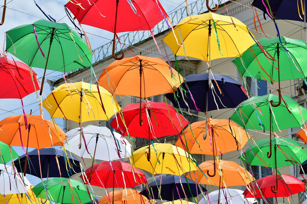 multi-colored umbrellas during a holiday on the street - Photo, Image