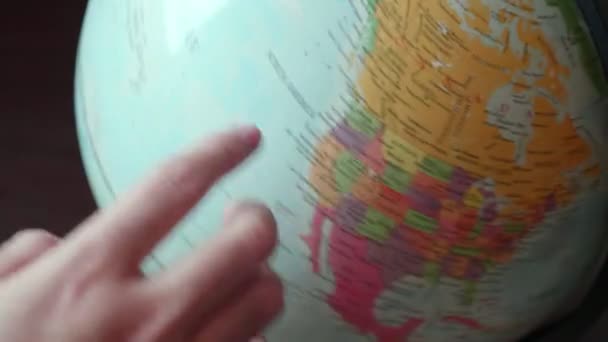closeup view of hand moving globe - Felvétel, videó