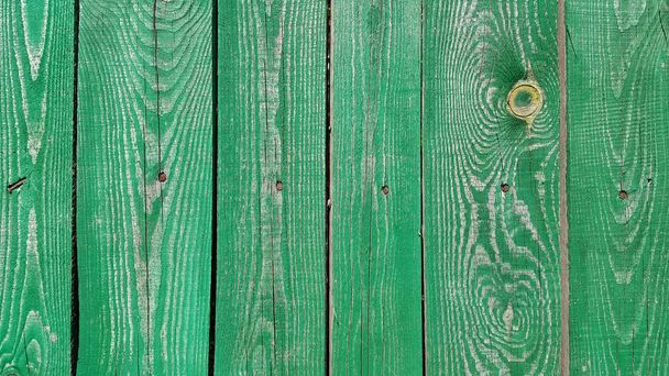 Texture of weathered wooden green painted fence - Foto, Bild