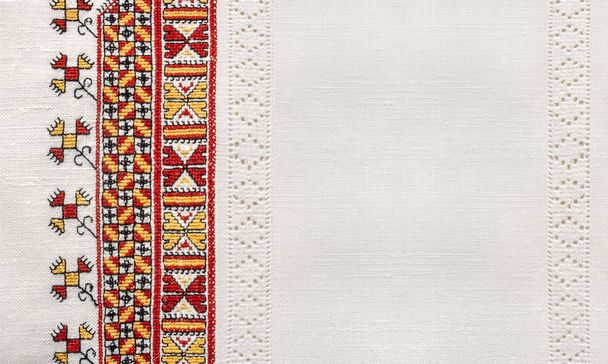 Ukrainian national hand embroidery on white linen - 写真・画像