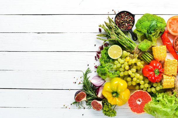 Fresh vegetables and fruits on a white background. Top view. Free copy space. - Foto, immagini