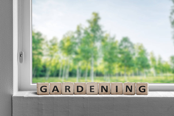 View to a garden in the spring with a gardening sign - Photo, Image