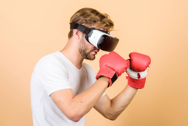 Be strong. man in VR glasses. Futuristic gaming. vr boxing. future innovation. modern gadget. Training boxing game. boxing in virtual reality. Digital sport success. man use new technology - Фото, зображення