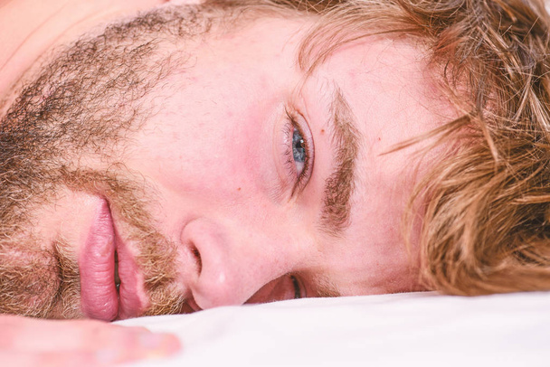 Man unshaven bearded face sleep relax or just wake up. Guy bearded macho relax in morning. Man attractive macho relax and feel comfortable. Simple tips to improve your sleep. Total relax concept - Foto, Imagen
