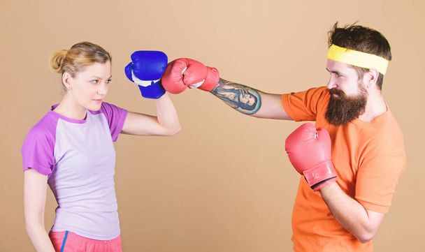 Family battle. Boxing sport concept. Couple girl and hipster practicing boxing. Sport for everyone. Amateur boxing club. Equal possibilities. Strength and power. Man and woman in boxing gloves - Photo, image