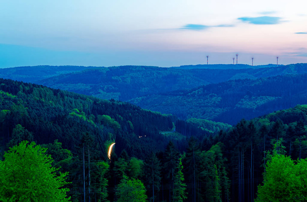Odenwald at Kortelshtte with sunset and wind turbines - Photo, Image