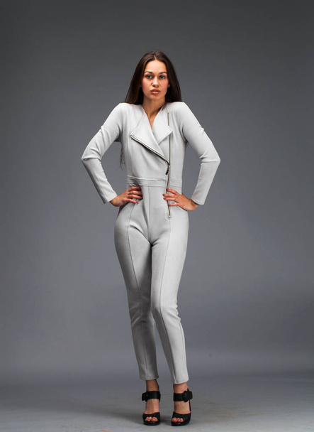 Sexy fashion brunette woman in gray leather suit  - Фото, зображення