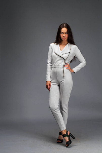Sexy fashion brunette woman in gray leather suit  - Zdjęcie, obraz