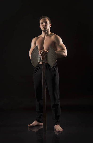 Strong athletic man showes naked muscular body. - Fotografie, Obrázek