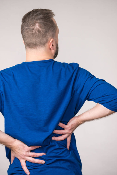 Man having back loins pain ache - Fotó, kép