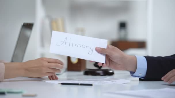 Attorney giving alimony to divorced woman, dollar savings for single mother - Filmmaterial, Video