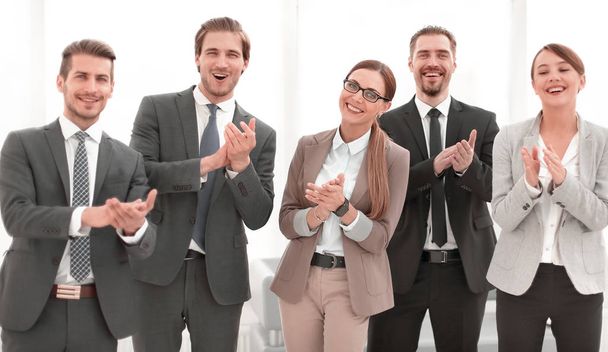 smiling business team applauds their success - Fotoğraf, Görsel
