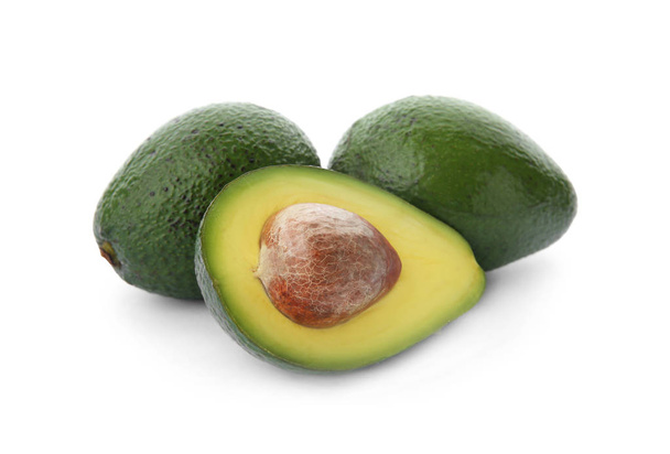 Ripe avocados on white background. Tropical fruit - Photo, image