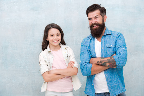 Father and daughter teammates. Team of dad. Bearded hipster man and adorable child girl. We are team. Family team. Parenthood and childhood. Fathers day concept. Trust and support. Best friends - Zdjęcie, obraz