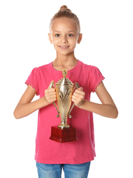 Happy girl with golden winning cup on white background - Valokuva, kuva