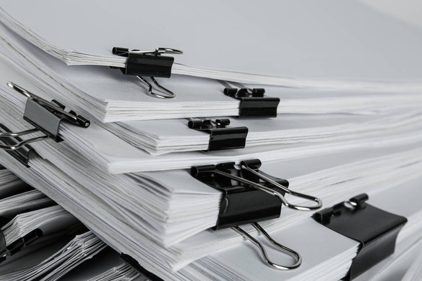 Pile of documents with binder clips, closeup - Foto, imagen