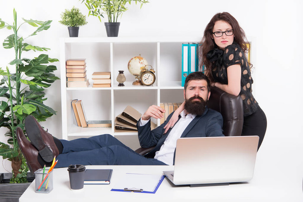 Working couple. Couple of lovers at workplace. Couple in love conducting affair at work. Romantic couple of bearded man and sensual woman in office - Foto, afbeelding