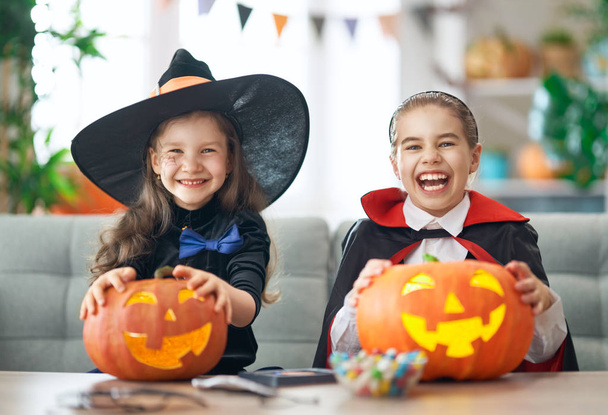 kids with carving pumpkin - Фото, изображение