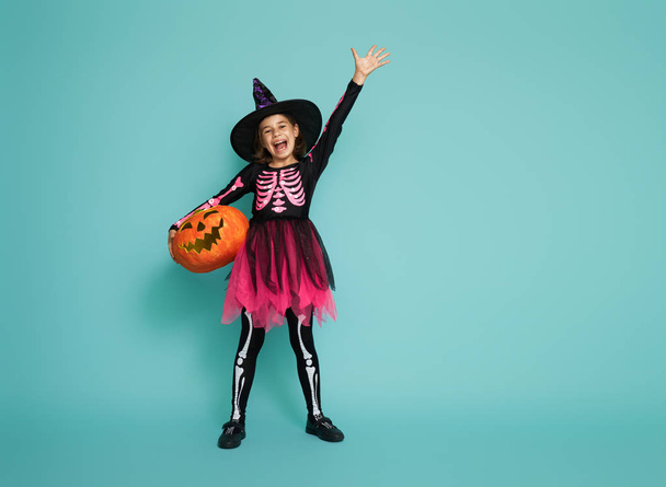 little witch on turquoise background - Photo, Image