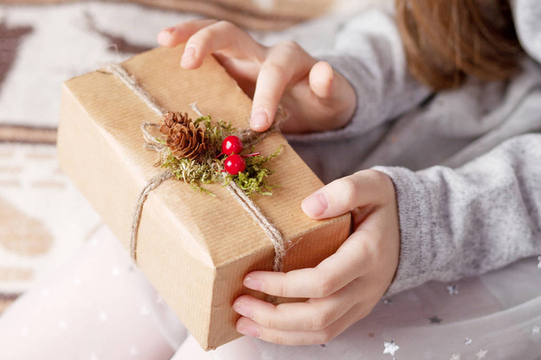 Girl's hands holding gift box. Copy space. Christmas, hew year,  - Zdjęcie, obraz