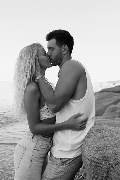 beautiful lovely couple wearing jeans,posing at summer beach - Foto, immagini