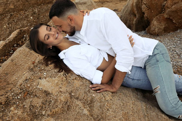 beautiful lovely couple wearing jeans,posing at summer beach - Foto, Imagem