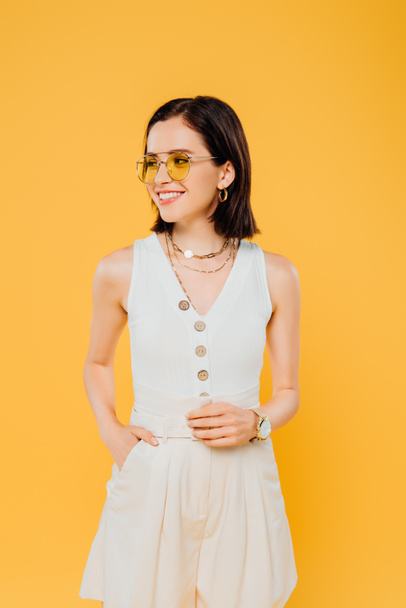 elegant woman in sunglasses smiling isolated on yellow - Foto, Imagen