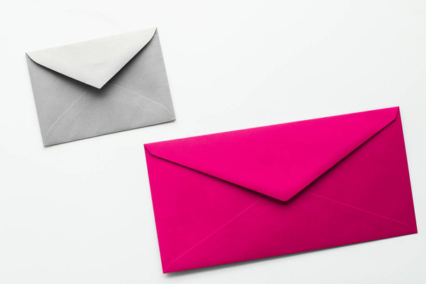 Blank paper envelopes on marble flatlay background, holiday mail - Photo, Image
