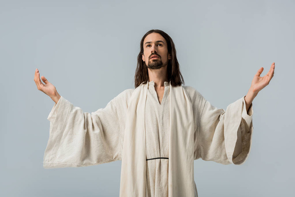 handsome man in jesus robe with outstretched hands isolated on grey - Φωτογραφία, εικόνα