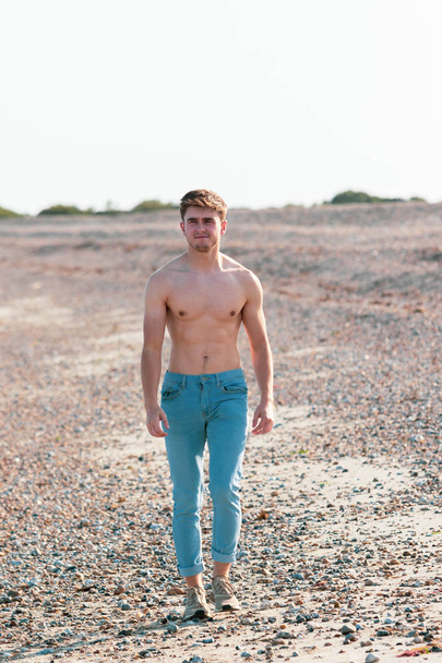 Shirtless on a beach - Foto, afbeelding