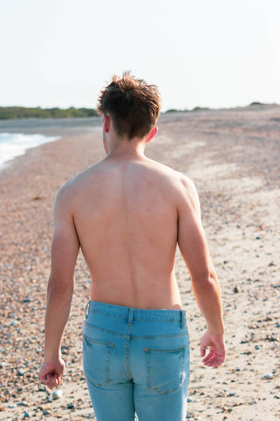 Shirtless on a beach - Фото, изображение