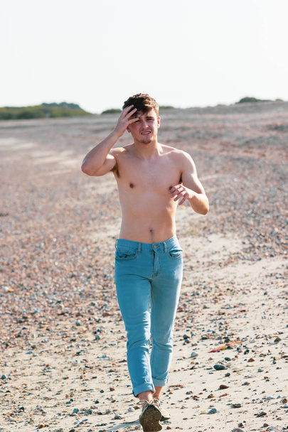 Shirtless on a beach - Photo, image